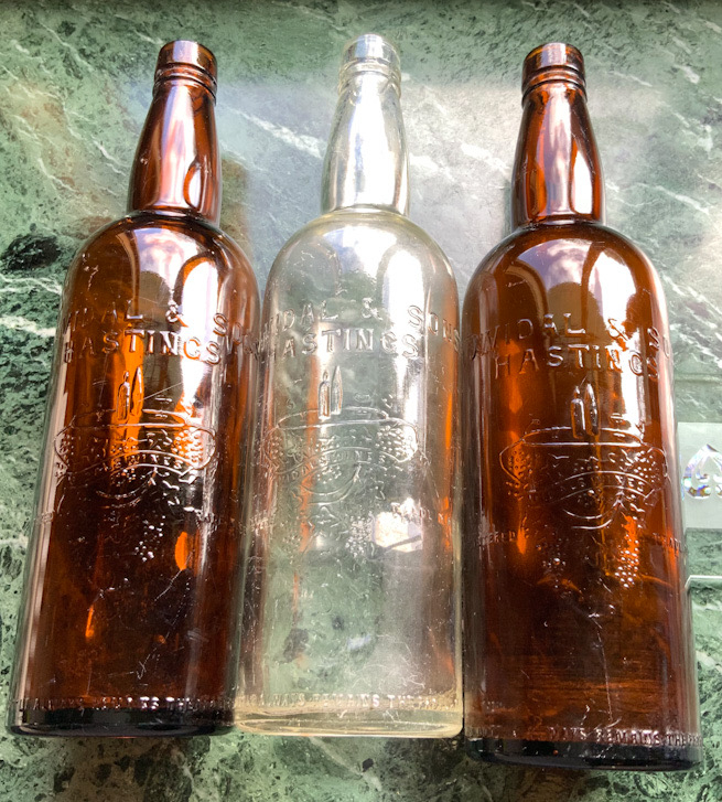 Three antique Vidal & Sons Hastings Wine bottles
